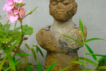 Stone statue in front of the shop
