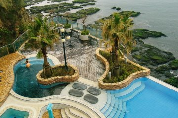 View of outdoor pools from a seat in the 4th floor Italian restaurant