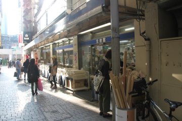 Store front of the fabric building. In a corner, they put the all the used cardboard rolls in a box for customers to take freely. Great service!