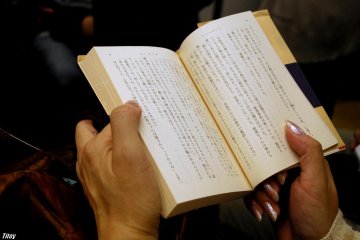 Reading a book is a great way to pass time on the metro