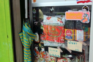 Authentic Thai fish sauce and noodle soups sit in the window.