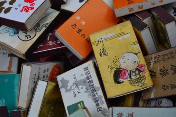 Matchboxes with retro designs on the covers.