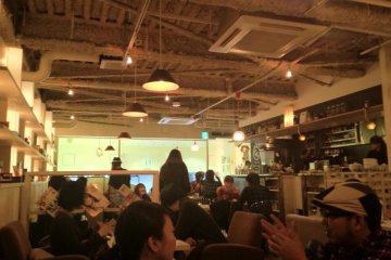 Diners lounging on sofas in Cafe Katsuo