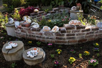 Cute garden with cat painted stones