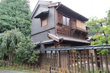 Old traditional style Japanese house at the side of the shrine