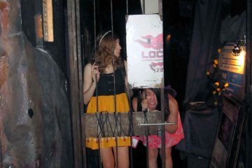 Enter The Lockup and weave through dark mirrored hallways to access the entrance.