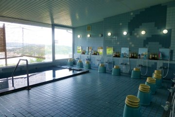 A communal hot bath (onsen) is located on the first floor