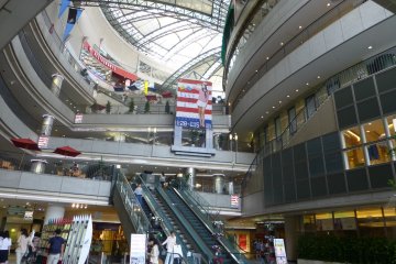 A modern multi-story building with 11 levels of shops and eateries