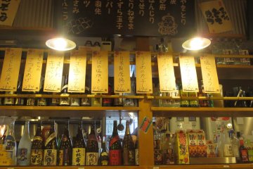 Menu on the wall with assorted alcohol and drinks