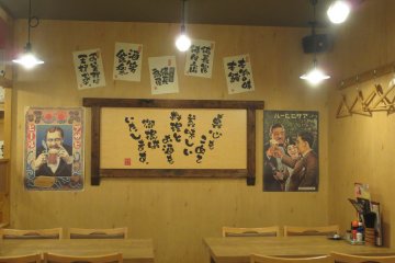 Fun decorations on the wall with hangers (perhaps to hang up business suits!)