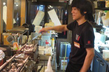 The chef working the charcoal grill