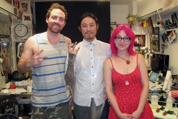 Kevin and I are happily posing with Hiroshi after almost a full day at Three Tides!