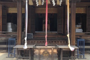 Ring the bell to get the diety's attention. Then make your wish!