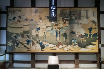 A mural depicting the history of sake making