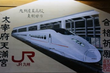 Find some JR Kyushu-themed artwork inside the station.