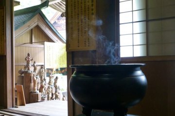 Early morning incense masks the smell of the rain