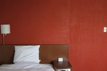 Scarlet red wall makes a good backdrop to the room