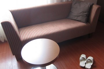 Scarlet red with golden stripes on the sofa