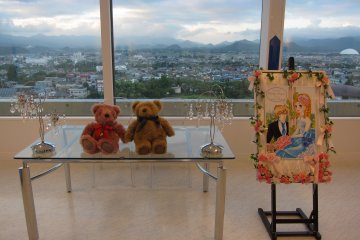 Two lovely bears sit in this well decorated room