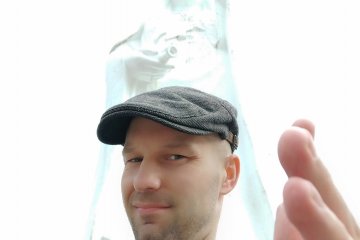 Author posing with the statue