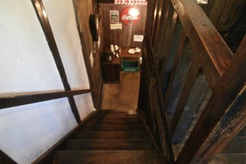 You can serve yourself a coffee for free at the foot of the stairs