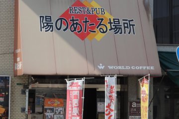 The restaurant sign seen from the station