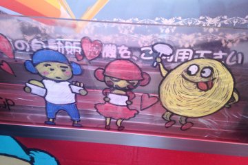 A happy Mr. Hottoku in Shin-Okubo