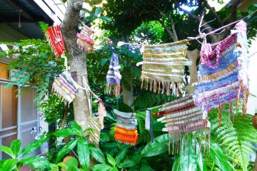 Colorful pieces of cloth hang outside the World Friendship Center
