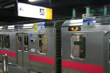 Getting on the red train.