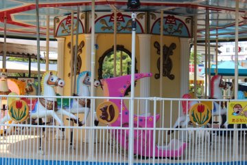The colorful Mini Amusement area features a number of rides for small children.