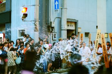 Throwing water: the tradition is said to cleanse the city