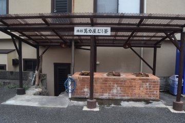 The brick structure houses steam ovens for cooking