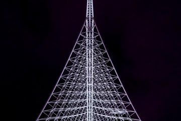 The Kobe Maritime Museum has a distinctive architectural roof that gets lit up at night, revealing a lattice of white steel.