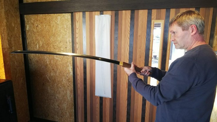 Viewing one of Taro's swords