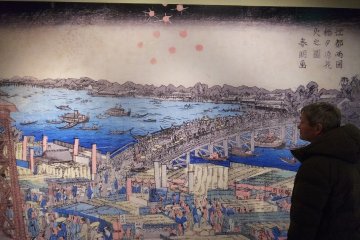 Viewing one of Hokusai's masterworks.