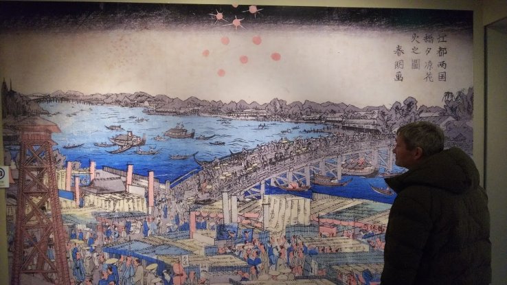 Viewing one of Hokusai's masterworks.