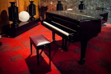 The odd piano sits around the place, adding to the class of the decor.