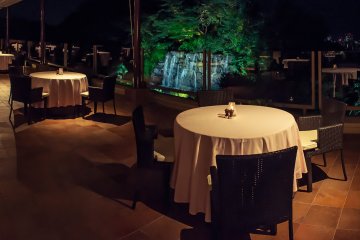 The dining area spreads out on to the balcony, giving amazing views over the large waterfall and Okayama city.