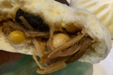 Filling inside the gomoku bun spilling out.