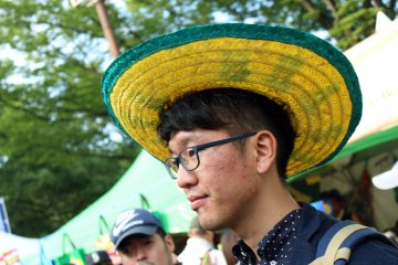 Many festival goers sport the colors of the Brazilian flag: yellow and green. These hats were quite popular.