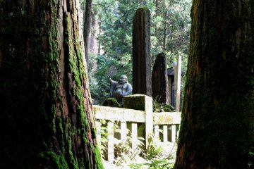 Statues of the seven gods of good fortune stand along the path