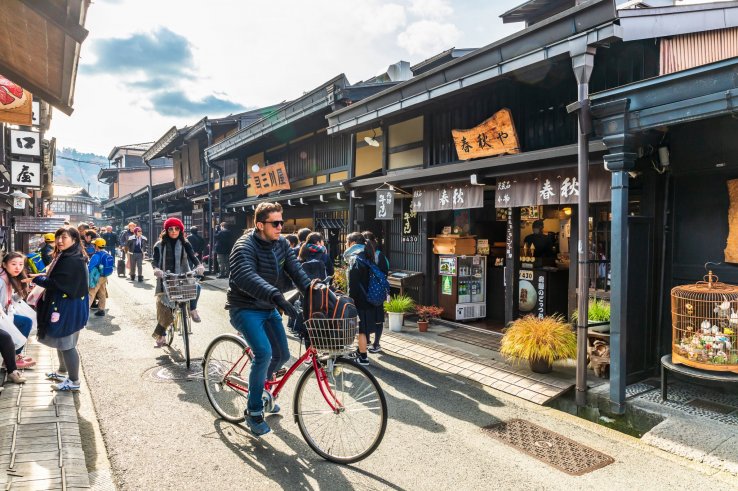If cycling in dense pedestrian areas, consider dismounting for safety
