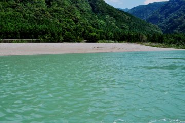 The Kumano River originates in the Kii Mountain Range and it flows into the Pacific Ocean
