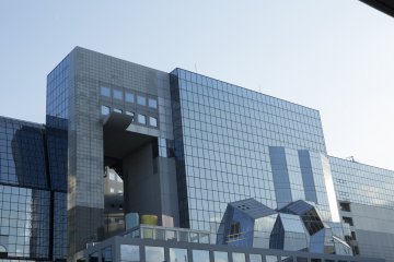 The glass front of the building distorts the reflection of the city in a way that I found reminiscent of cubism