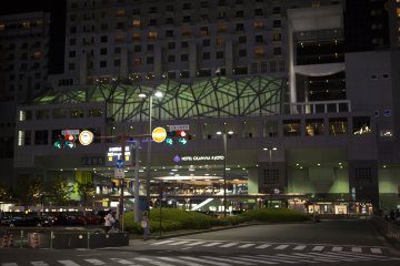 The pale green luminance of the station stands out amongst the more cliché neon glow of a city after dark.