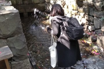 Ritual of throwing water on a rock