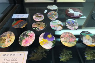 Intricate, colorful brooches