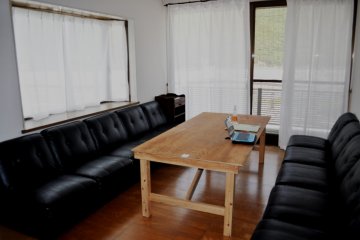 The living room, next to the kitchen