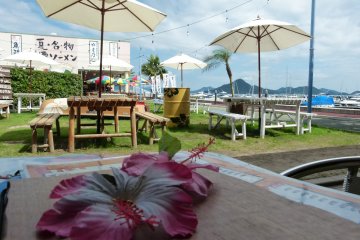 Some dining areas and bars are open-air terraced areas with views of the sea