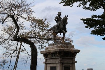 The monument facing the city located at the foot Aoba Mountain